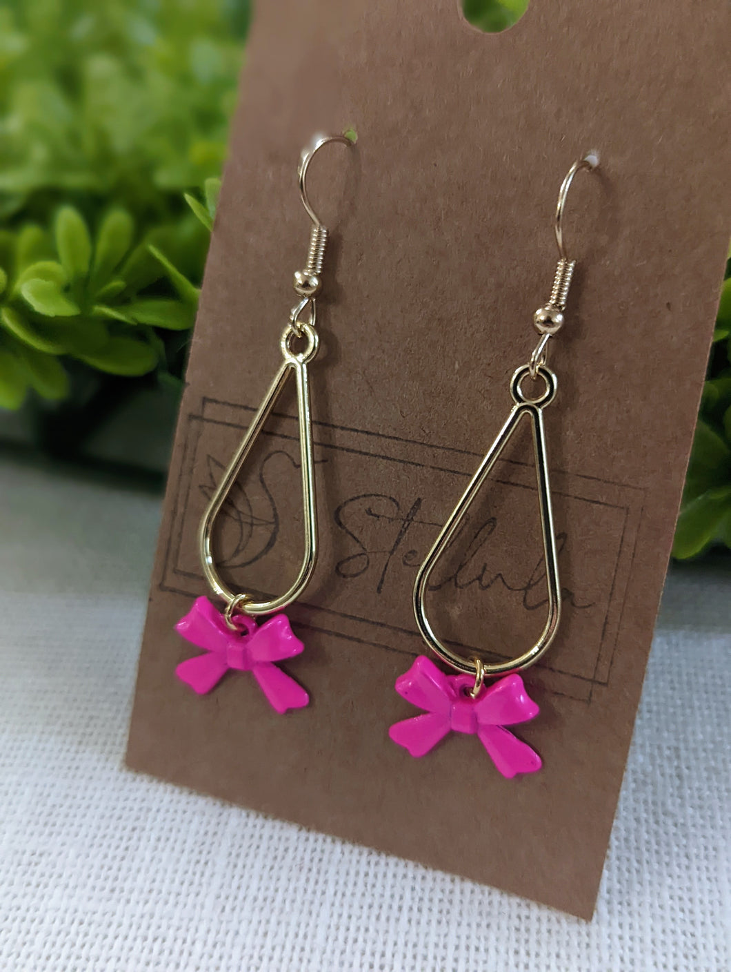 Gold pink bow earrings