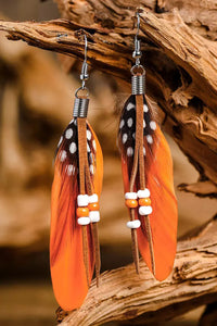 Orange Rice Bead Long Peacock Feather Earrings